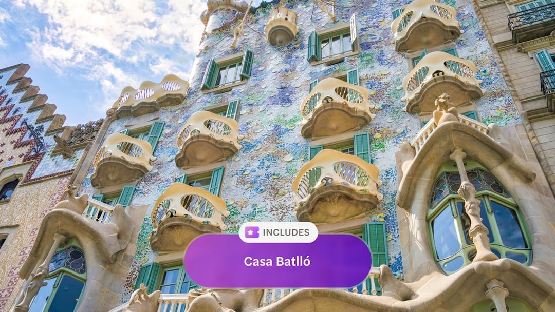 Casa Batlló facade with colorful mosaic tiles and unique balconies in Barcelona.