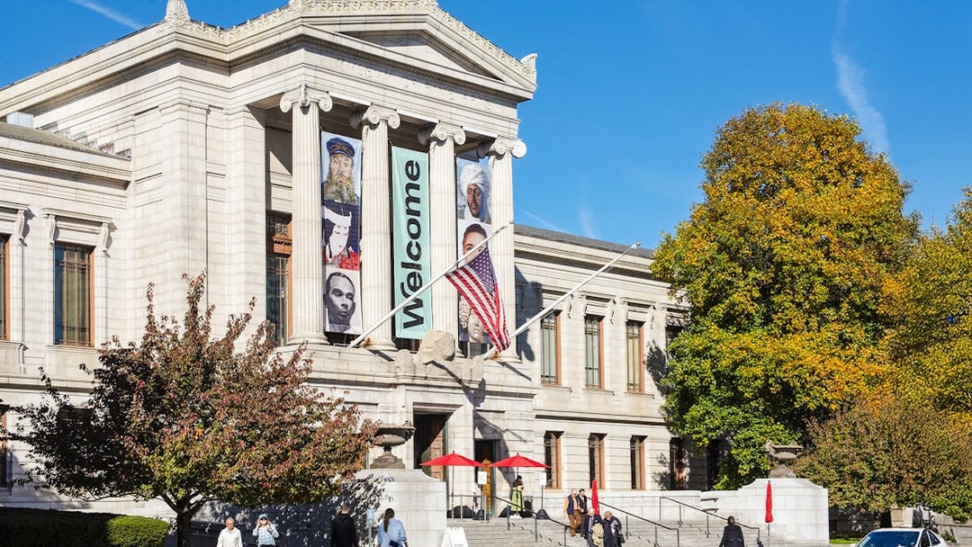 Museum of Fine Arts Boston entrance with banners and visitors.