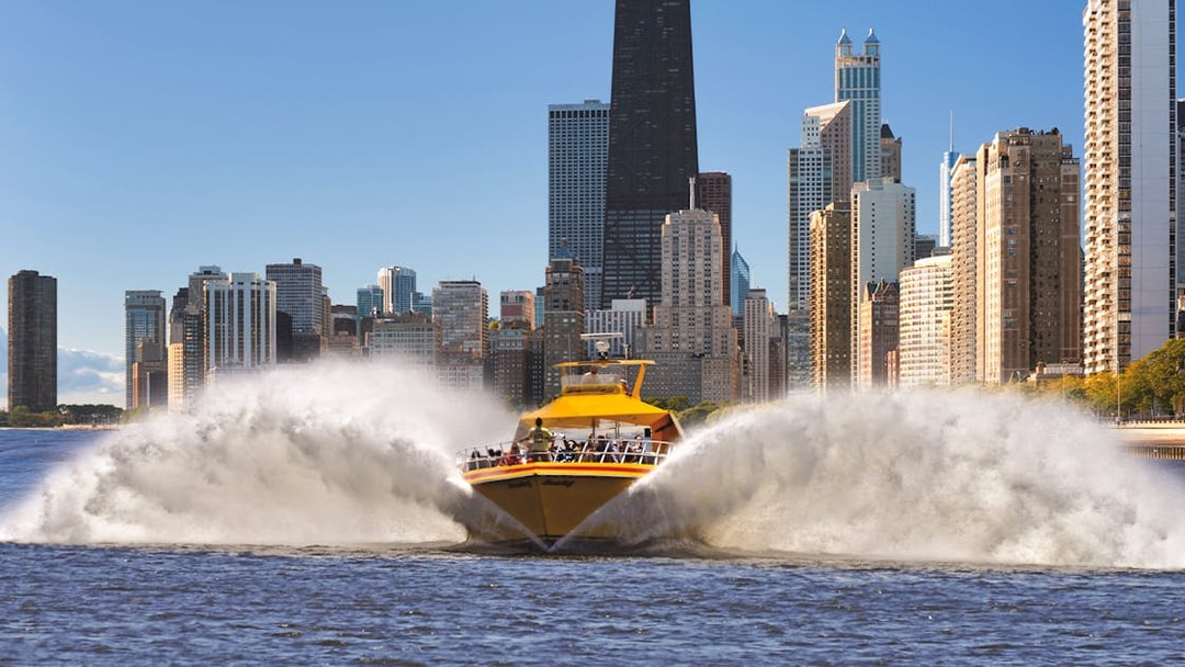 Speedboat on Lake Michigan with Chicago skyline in the background.
