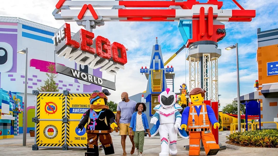 LEGO Movie World entrance with characters and visitors at a theme park in Los Angeles.