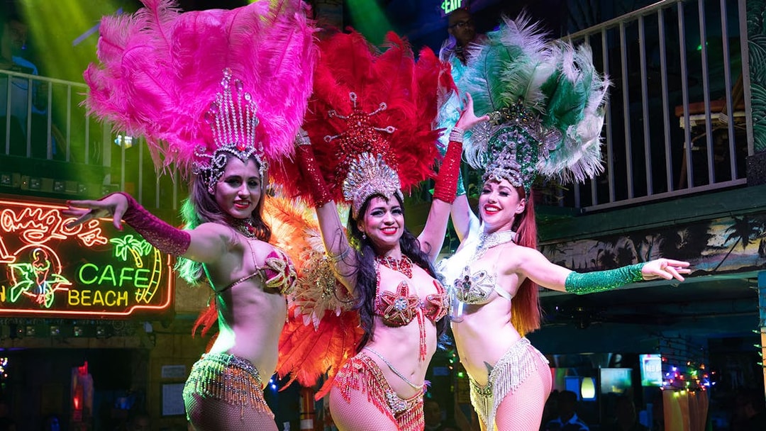 Salsa dancers performing at a vibrant Miami nightclub.