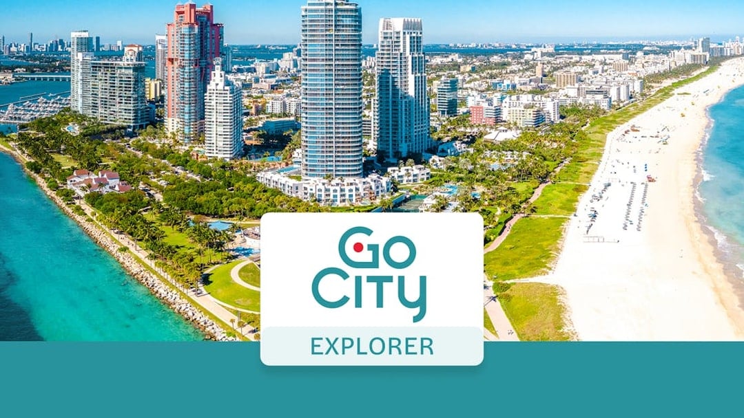 Miami skyline with beach and Go City Explorer Pass logo.