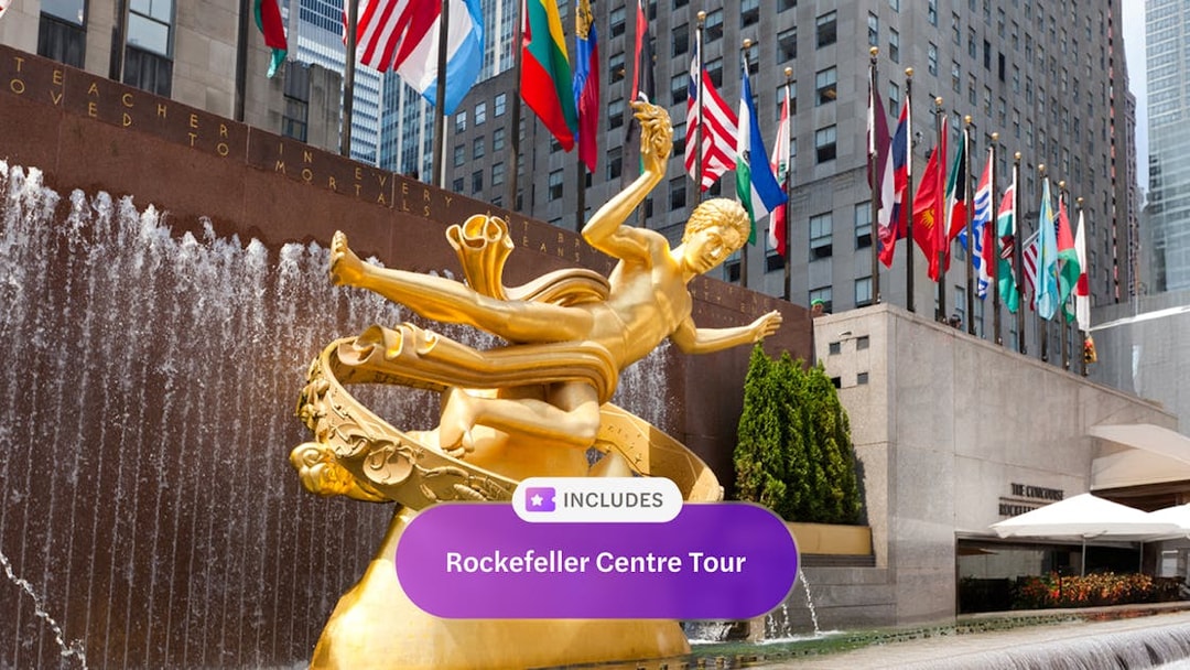Prometheus statue at Rockefeller Center with international flags, New York Explorer Pass.