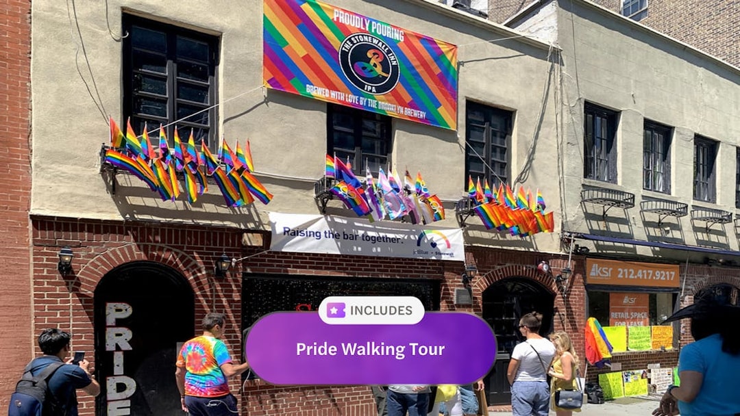 Stonewall Inn with rainbow flags during Pride Walking Tour in New York City.
