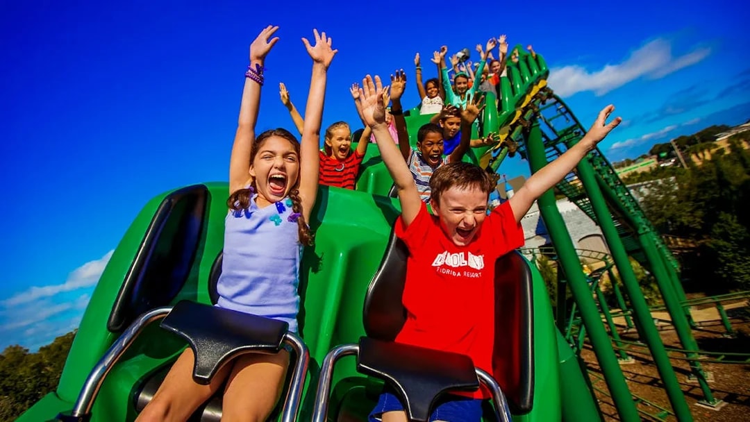 Children enjoying a roller coaster ride at an Orlando theme park.
