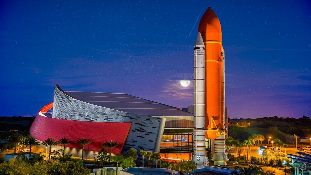 Kennedy Space Center rocket display at night, Orlando Explorer Pass.