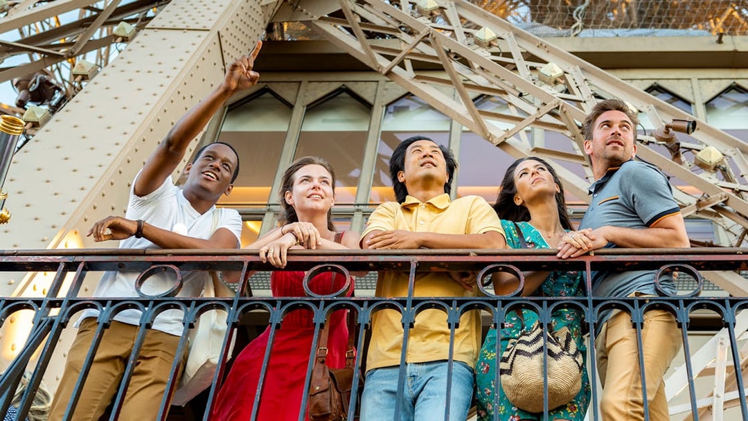 Visitors enjoying the view from the Eiffel Tower's 2nd floor during a Paris city tour.