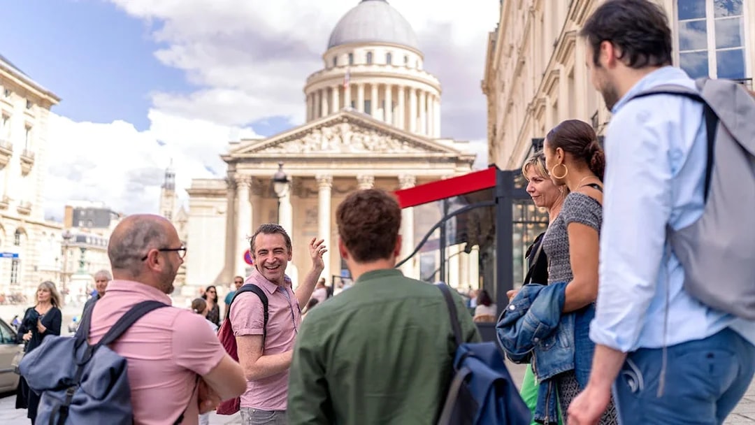 Tourists on a guided walking tour in the Latin Quarter, Paris, near the Panthéon.