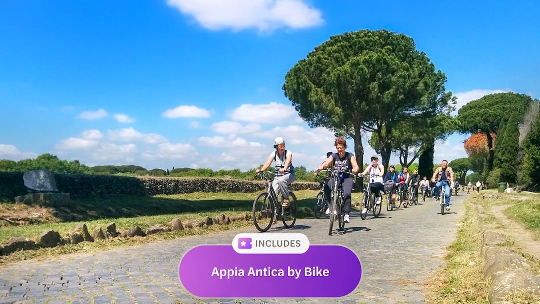 Cyclists riding along the ancient Appia Antica road in Rome, surrounded by greenery.