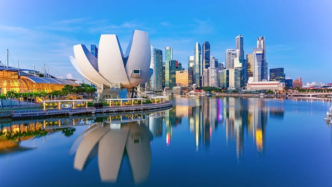ArtScience Museum with futuristic design by Marina Bay, Singapore skyline in background.