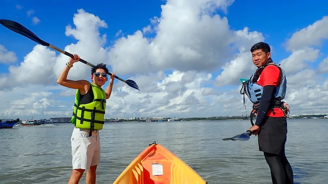 Kayaking in Singapore with Go City All-Inclusive Pass, featuring two people in life vests.