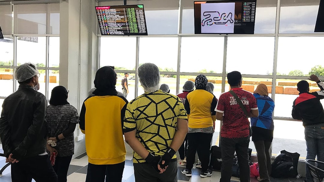 Visitors watching go-kart race results at Morac Adventure Park, Langkawi.