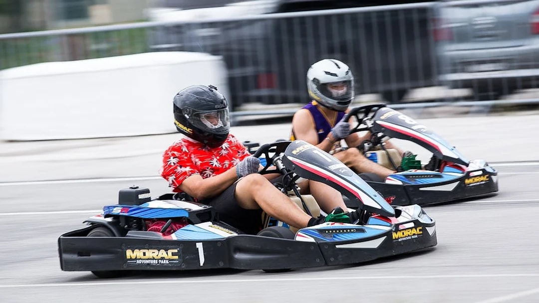 Go-kart racing at Morac Adventure Park, Langkawi, featuring two drivers on the track.