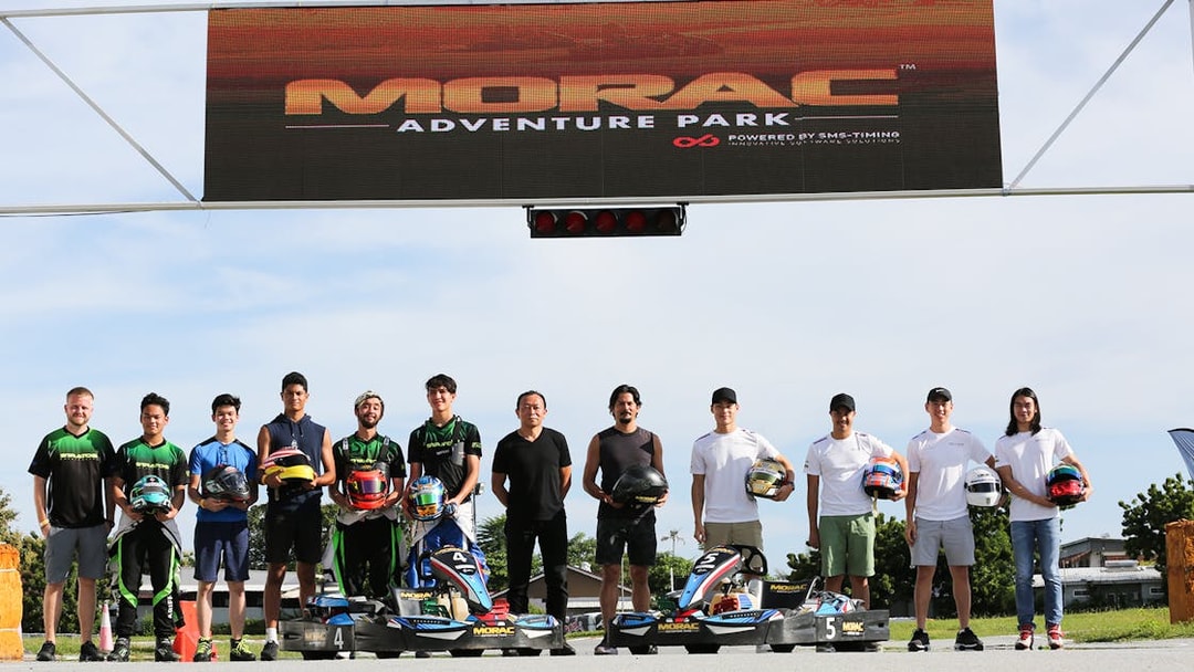 Participants holding helmets at Go-Kart Langkawi, Morac Adventure Park.