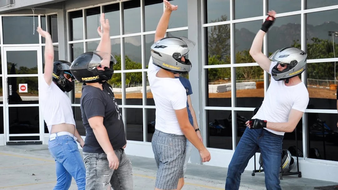 Participants in helmets preparing for a race at Go-Kart Langkawi, Morac Adventure Park.