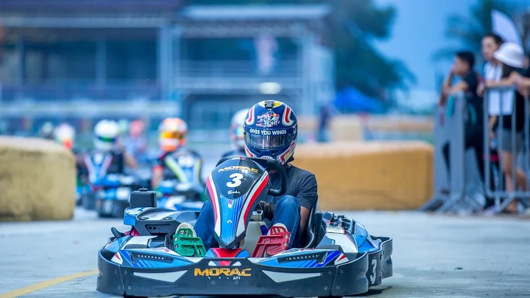 Go-kart racing at Morac Adventure Park, Langkawi, with driver on track.