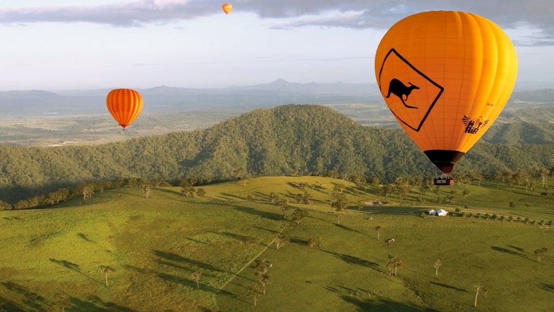 Hot air balloons over Gold Coast landscape, Australia.