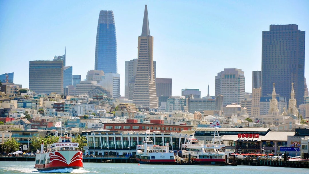 Golden Gate bay cruise boat with San Francisco skyline in the background, USA.