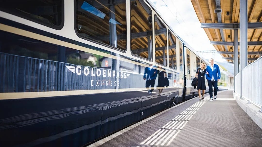 GoldenPass Express train at station platform in Interlaken, Switzerland.
