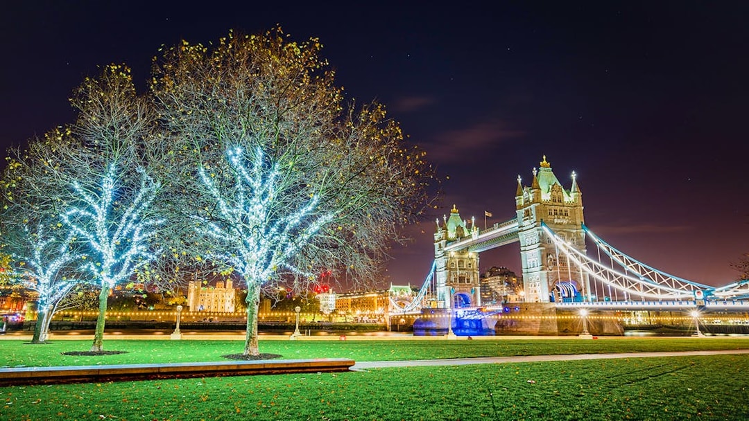 Tower Bridge illuminated at night with Christmas lights in London.