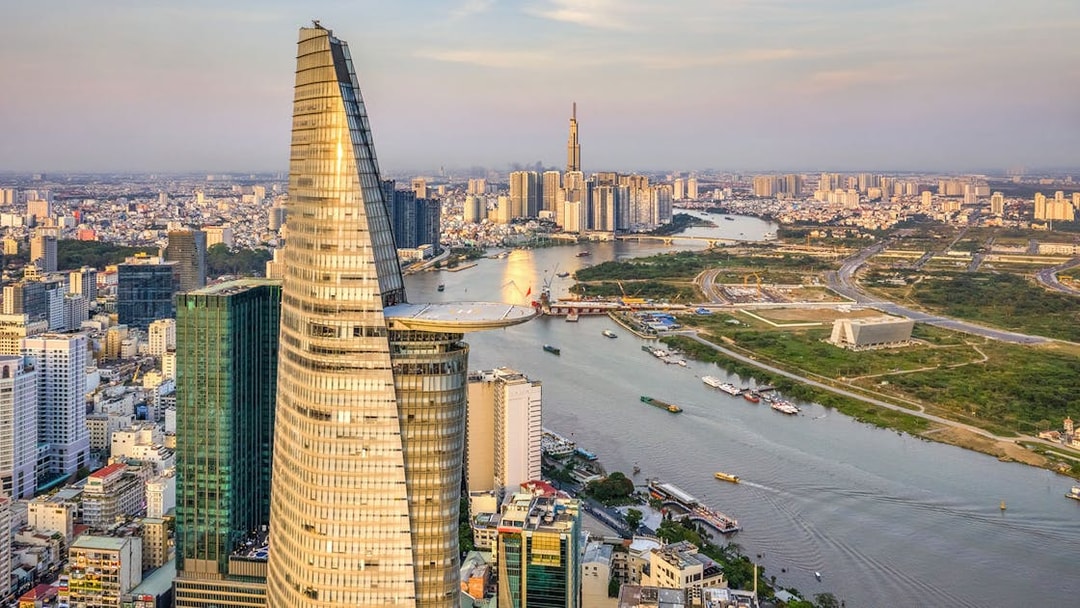 Panoramic view of Saigon cityscape with Landmark 81 and river.