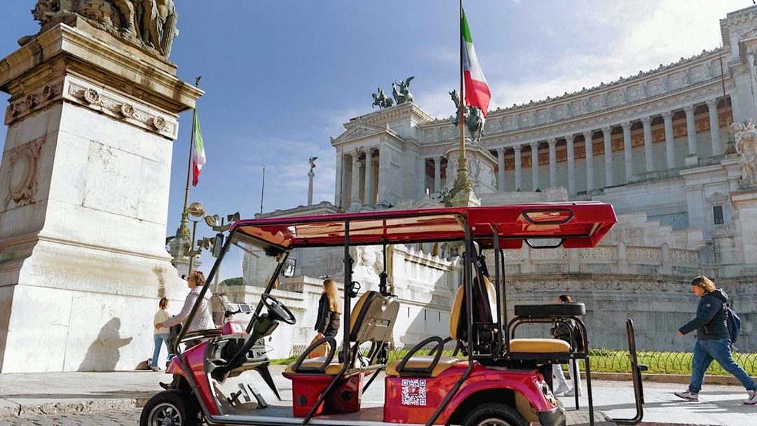 Golf cart near Altare della Patria in Rome during tour.