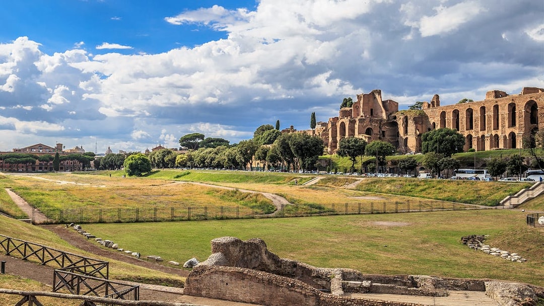Circus Maximus ruins with surrounding greenery in Rome, Italy.