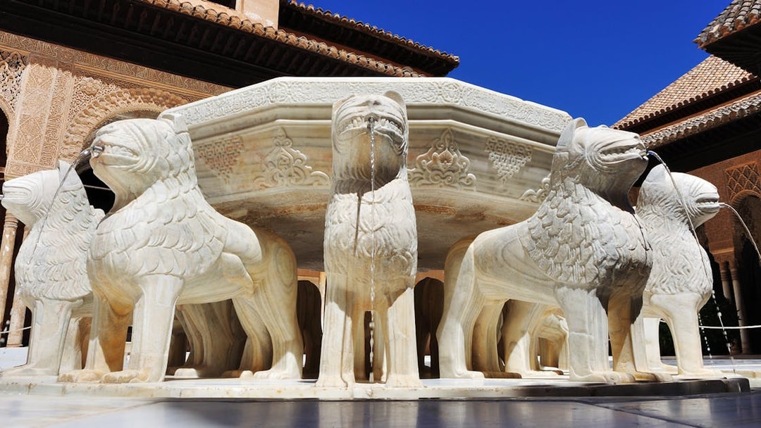 Lion Fountain at the Alhambra in Granada, part of a guided tour including the Cathedral and Royal Chapel.