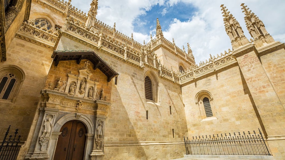 Royal Chapel of Granada exterior with ornate Gothic architecture.