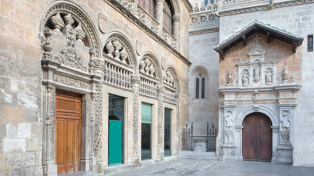 Granada Cathedral ornate stone facade with detailed carvings and arched doorways.
