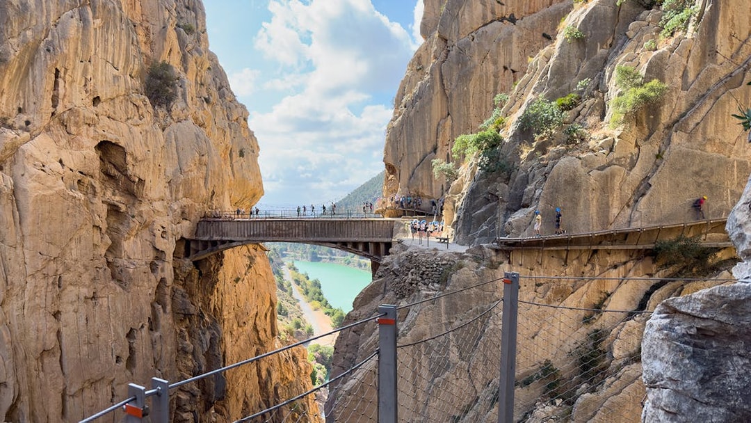 Caminito del Rey walkway between cliffs with tourists, near Granada and Seville, Spain.