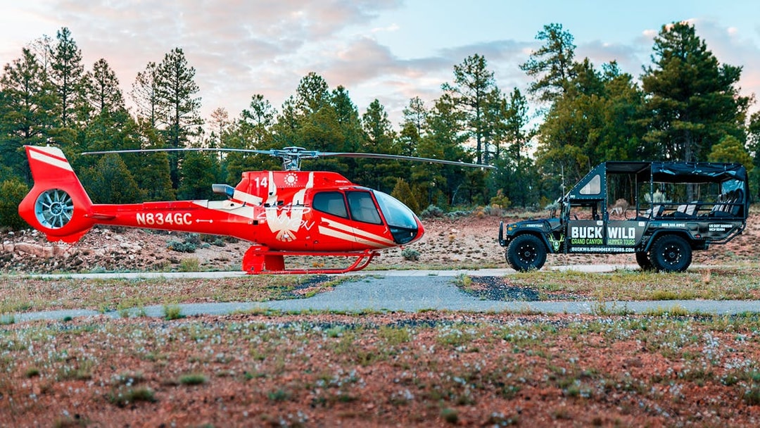 Helicopter and Hummer for Grand Kingdom tour in forest setting.