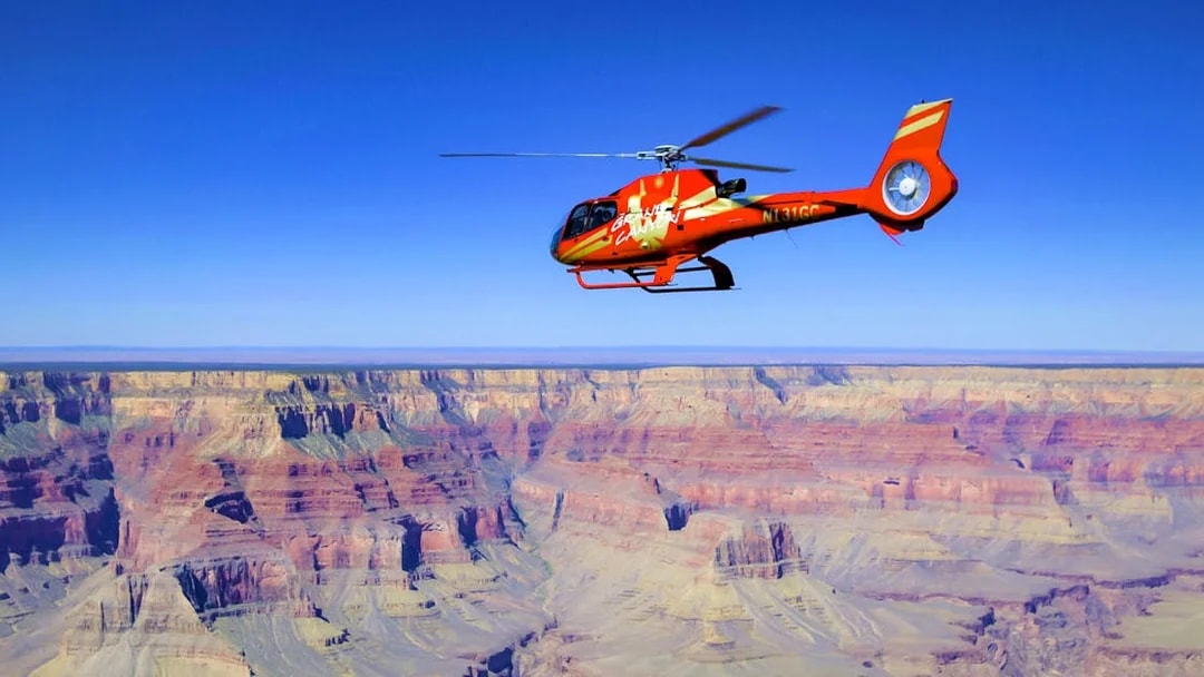 Helicopter flying over the Grand Canyon during Grand Kingdom Hummer Tour.