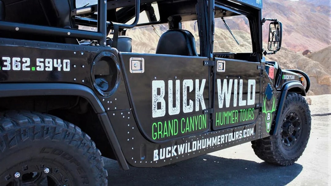Hummer vehicle for Grand Canyon tour with Buck Wild branding.