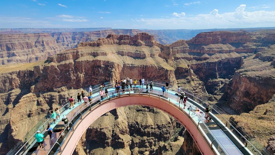 Visitors enjoying the view from the Skywalk at Grand Canyon West Rim, Arizona, USA.