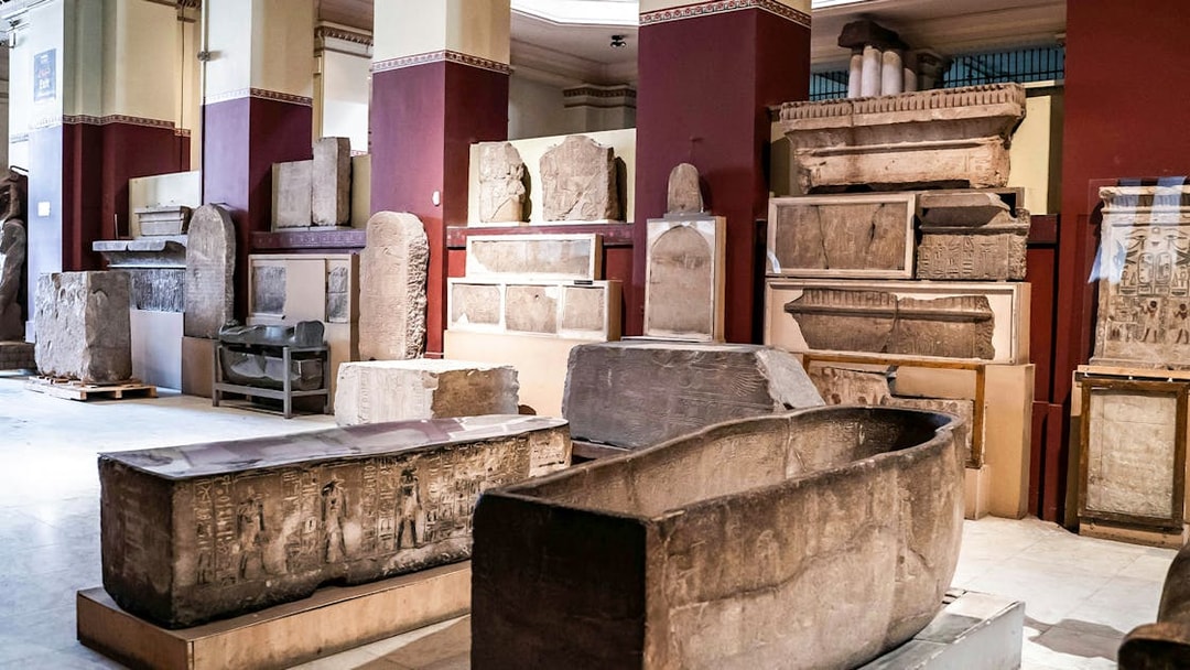 Artifacts and sarcophagi displayed in the Grand Egyptian Museum.