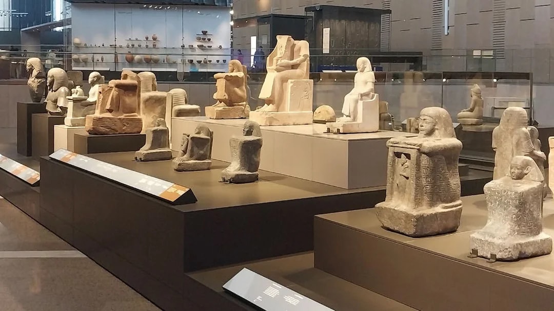 Ancient Egyptian statues displayed at the Grand Egyptian Museum.