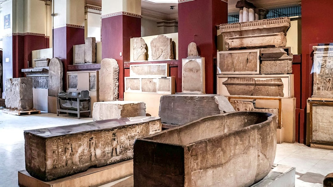 Ancient Egyptian artifacts displayed in the Grand Egyptian Museum.