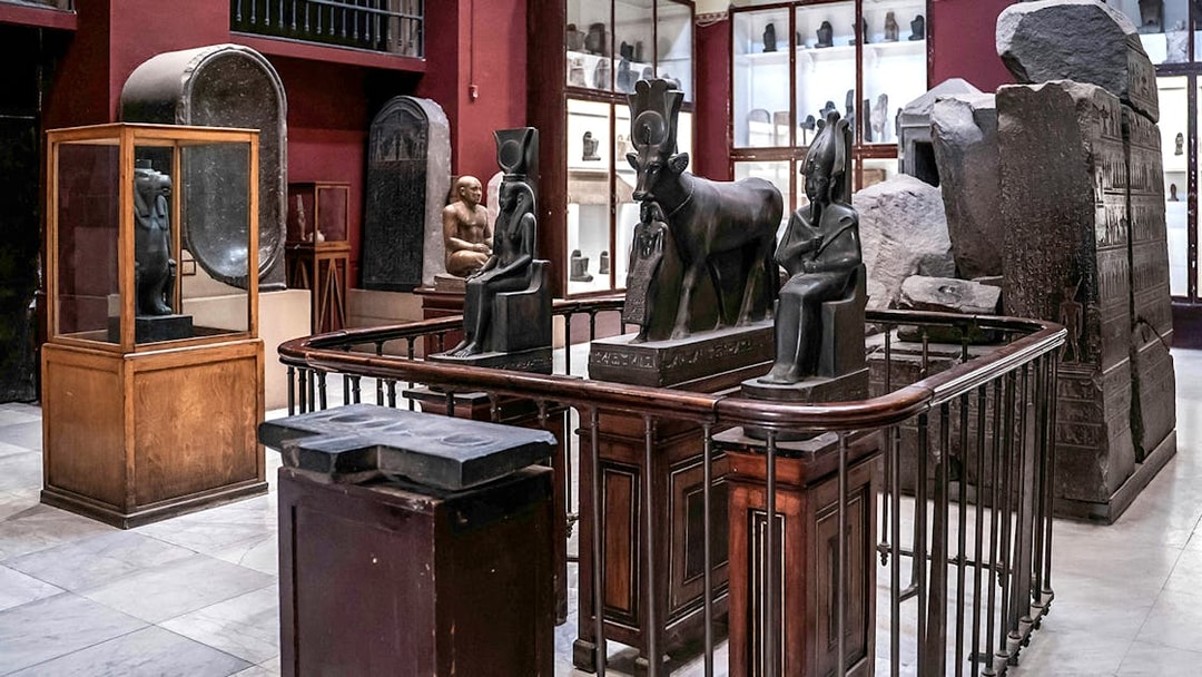 Ancient Egyptian statues and artifacts displayed in the Grand Egyptian Museum.