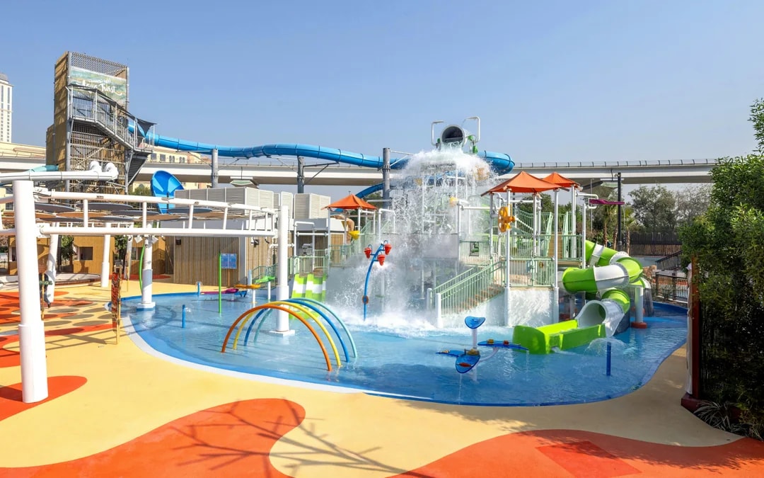 Kids play area with water slides and splash features at Grand Hyatt waterpark, Dubai.