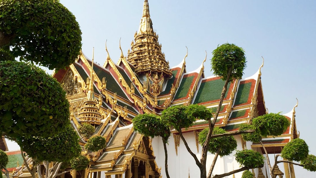 Grand Palace ornate roof and trees, Bangkok, on Wat Phra Kaew walking tour.