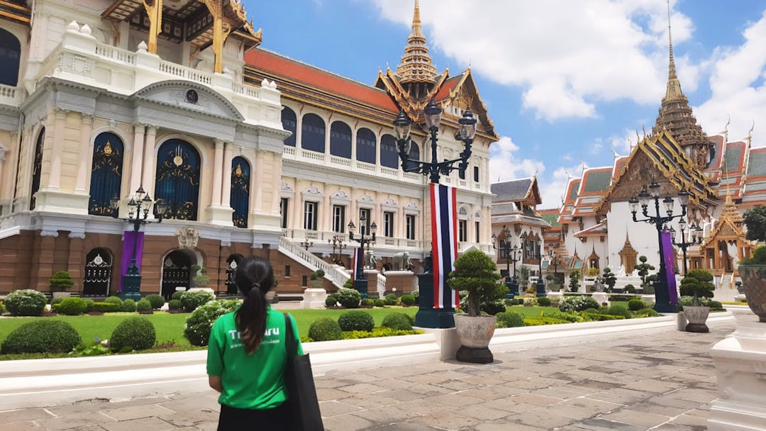Grand Palace and Wat Phra Kaew with visitor on walking tour in Bangkok, Thailand.
