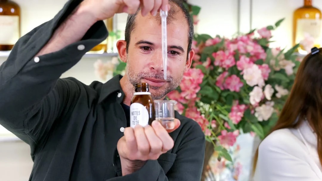 Man creating perfume with dropper at Mini Perfume Workshop in Grasse.