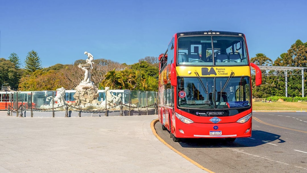Buenos Aires city bus near Monumental Fountain of the Nereids.