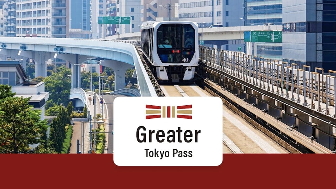 Urban train on elevated tracks in Tokyo cityscape, promoting Greater Tokyo Pass.