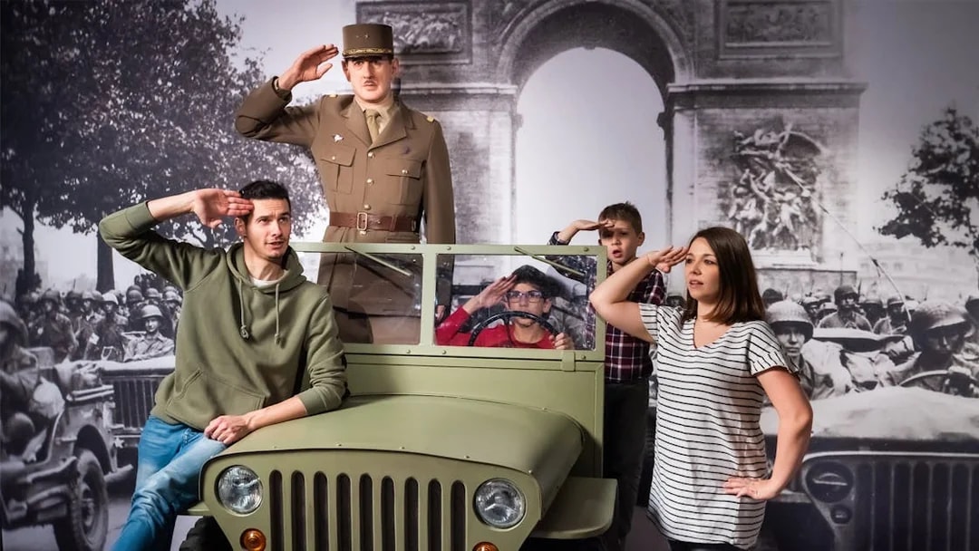 Visitors posing with a wax figure of a military officer at Grévin Paris Wax Museum.