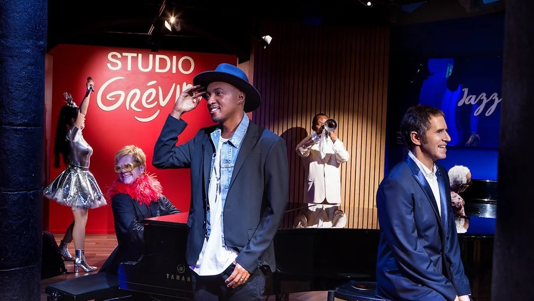 Wax figures of musicians and performers at Grévin Paris Wax Museum.
