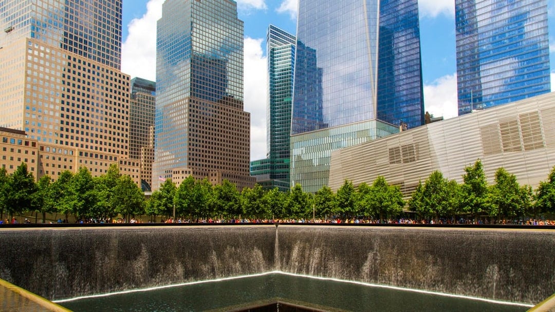 North Pool at National September 11 Memorial Museum, New York City, with surrounding skyscrapers.
