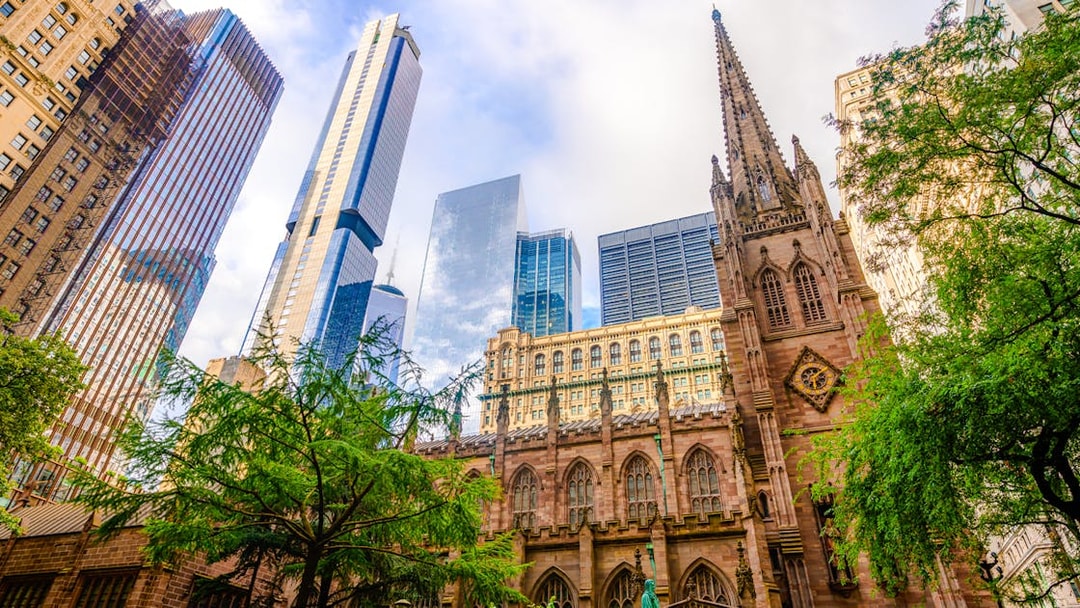 Trinity Church with skyscrapers in lower Manhattan, New York City.