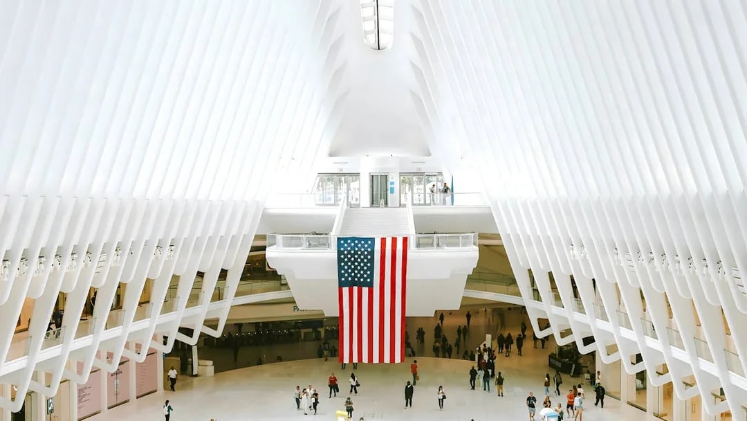 World Trade Center Transportation Hub interior with American flag hanging.